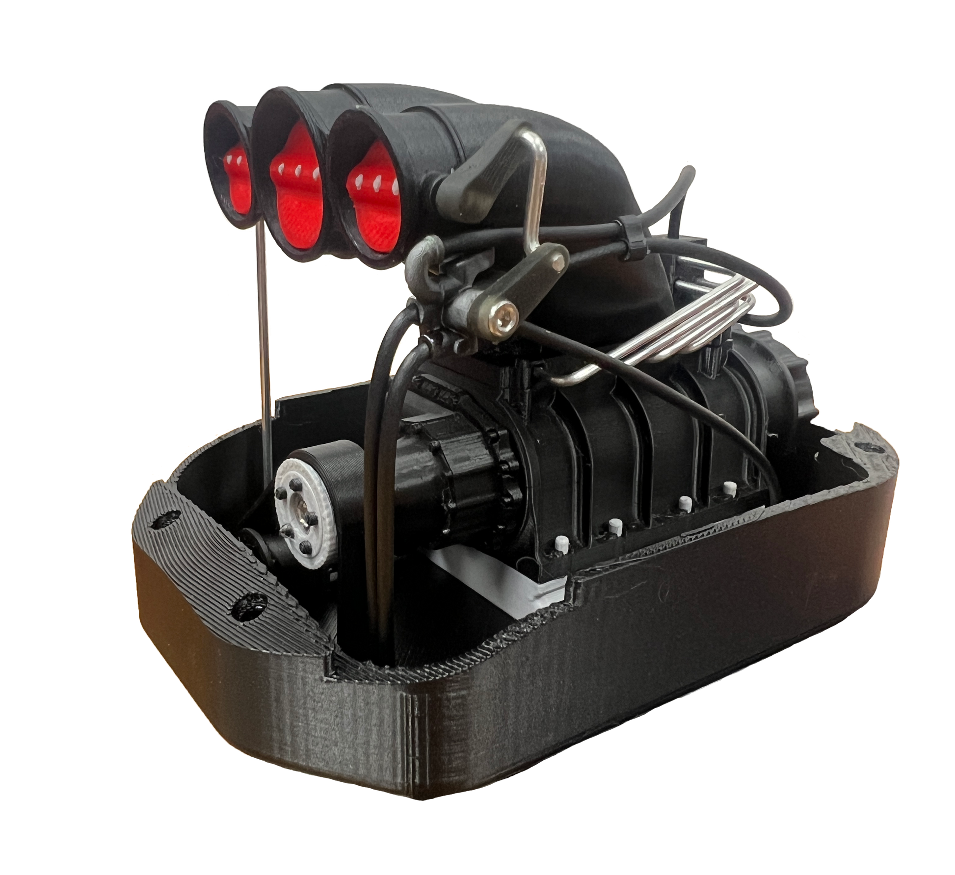 Black mechanical model with red lights on a white background